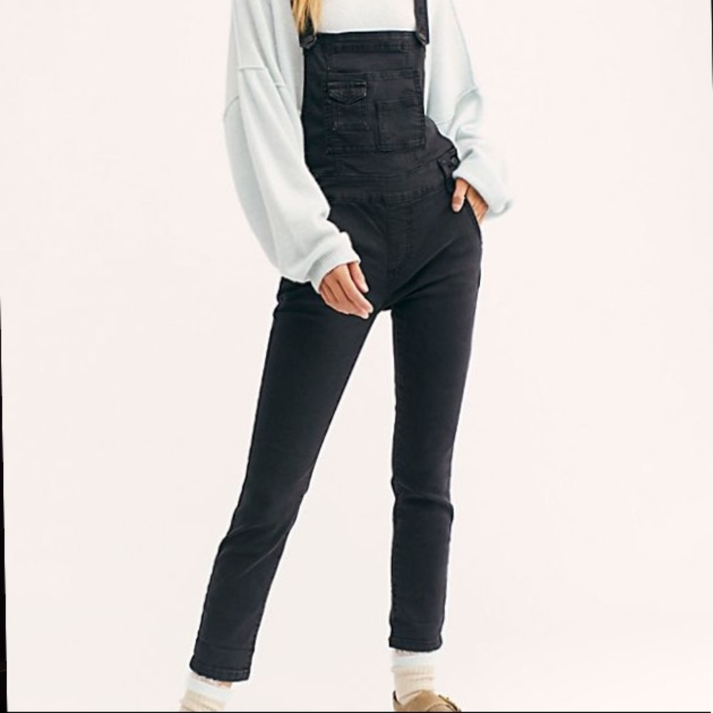 Free People washed denim overalls in black.